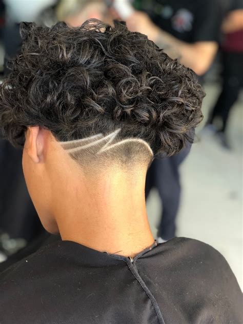 These braided men’s hairstyles can elevate your look for a fashionable finish that will impress. . Designs on taper fades